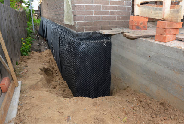 SJ Waterproofing Pros technician performing targeted Waterproofing assessment in Roanoke, VA